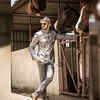 Photo: Bhushan Pradhan strikes a stylish pose in a horse stable
