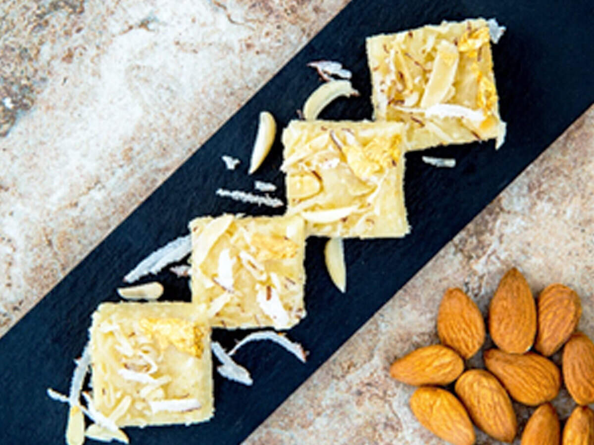 Almond Coconut Burfi Recipe: How to make Almond Coconut Burfi Recipe for Diwali at Home | Homemade Almond Coconut Burfi Recipe - Times Food
