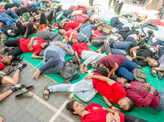 Mumbaikars participate in a 'die-in' to protest climate change