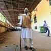 100 year old Khilari Ram Sharma casts his vote at Pawar public school in Bhandup West. He did not use wheelchair and preferred walking with the help of a stick.