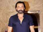 Bobby Deol happily poses for the papz