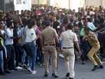 Mumbai Police try to disperse crowd