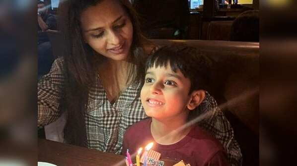 Dalljiet cutting the cake with Jaydon