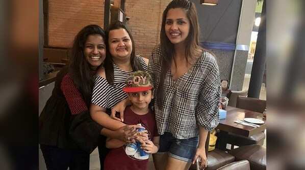 Dalljiet with Jaydon and his school teachers