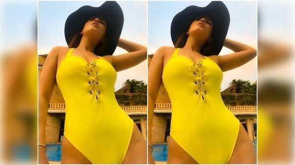 Bigg Boss 11 fame Bandgi Kalra sets the temperature soaring in this bright yellow monokini