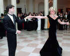 Princess Diana's iconic blue velvet evening gown that she wore to dance with Travolta is now up for auction
