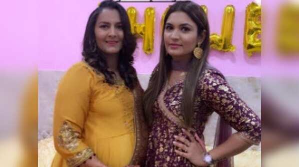 Flaunting baby bump in style