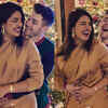 ​Nick Jonas and Priyanka Chopra get cute and cuddly for a perfect Christmas photo
