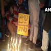 Students of Aligarh Muslim University (AMU) hold candlelight protest against the violence at JNU