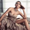 Flaunting her irresistible figure in a strapless gown