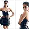 Super sexy in a strapless leather dress; smoky eyes and sleek wet slicked back hair compliment her look