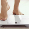 ​Step on the weighing scale