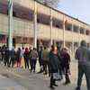 People line up in CR Park B Block to cast their votes.