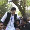 AAP's Raghav Chadha celebrates with party workers as trends show he is leading by more than 18,000 votes from Rajinder Nagar constituency.