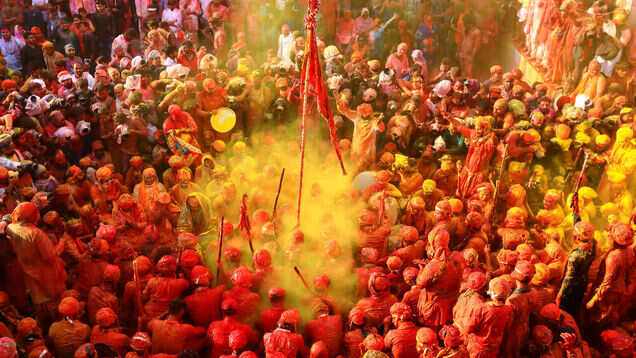 Tourists, devotees throng Barsana village to celebrate Laddu Maar Holi today