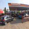 Motorists rush to buy fuel as lockdown begins in Mysuru on Monday.