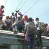 Patna: People in large numbers travelling atop buses due to cancellation of passenger trains by Indian Railways and lockdown announced by the state government.