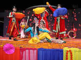Club members play phoolon ki Holi at an event