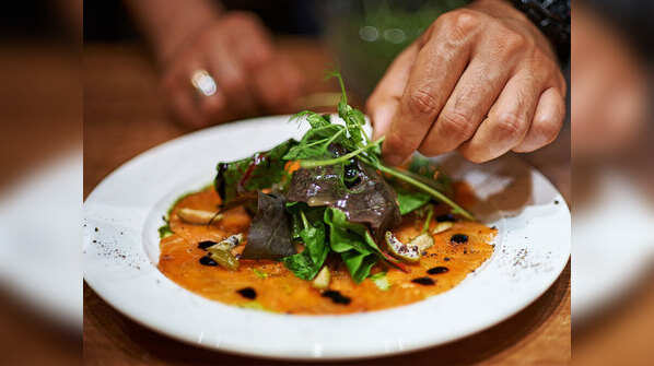 Avoid touching cooked food with hands