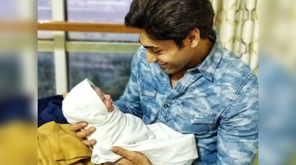 Bonding instantly with his little bundle of joy