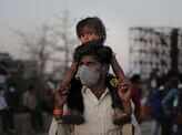 Coronavirus: Tear-jerking pictures of migrants fleeing to villages