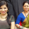 Jennifer and Sonalika posing on the set