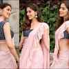 Flaunts her irresistible figure in a pink ruffle saree