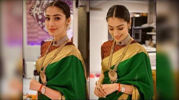 Cynosure of all eyes! Slips into a traditional saree and complements the look with a choker diamond necklace