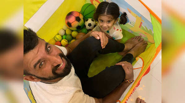 Cheteshwar Pujara with his daughter