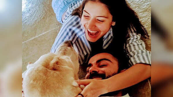 Virat Kohli and Anushka Sharma with their pet