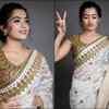 Rashmika slips into a white and gold embroidered saree for an awards event