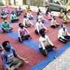 Moradabad: Migrant workers staying at temporary shelter home set up in Gandhi Nagar public school participate in a yoga class