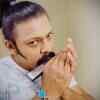 Article image for: Devdtta Nage showing his hidden talent of playing mouth organ