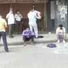 Delhi: People have kept their belongings like helmets, bottles, sacks to mark their positions in queues outside liquor shops in Vasant Vihar.