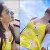 Andrea enjoys the cool breeze in an appealing yellow dress