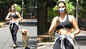 Arjun Rampal's girlfriend Gabriella Demetriades gets snapped in an all-black athleisure as she walks her pet dog on the streets of Mumbai