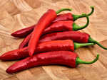 Remove seeds from chilli peppers to reduce heat