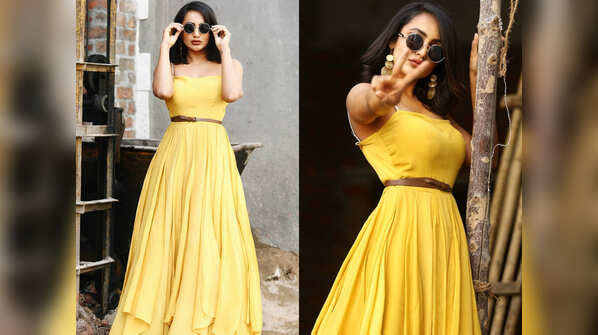 The stunning diva is seen clad in a A-Line yellow maxi dress