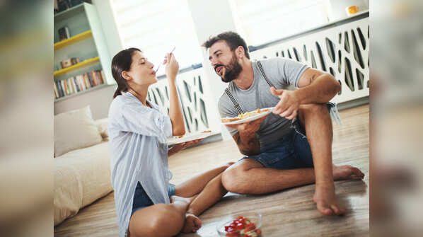 Sitting cross-legged and eating