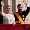 Prince Guillaume of Luxembourg holds an umbrella for his wife, Princess Stephanie