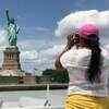 Article image for: Covid-19 in US: <i class="tbold">statue of liberty</i> opens as New York City hits phase 4 of reopening