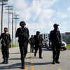 Article image for: Kentucky: Armed protesters march against <i class="tbold">police brutality</i>