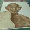 Tamil Nadu: An artist, Shiva Raman, attempted to enter Guinness World Records by painting Mahatma Gandhi's portrait in 2,020 square feet area using coffee, in Chennai.