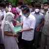 Delhi Chief Minister Arvind Kejriwal handovers a cheque of Rs 1 Crore to the family of Raju, a sanitation worker who died due to Covid-19 while carrying out his duties.