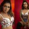 Ups the hotness quotient in a floral top and denim shorts