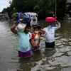 A family from Sangli cross flooded King Circle in Mumbai