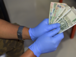 New study finds the virus can last for 28 days on notes and phone screens