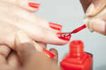 ​Apply a thin coat of nail colour