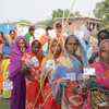 Women voters queque up at a polling both in Vaishali's Raghopur constituency where Tejashwi Yadav is in fray