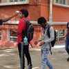 Students of Sheshadripuram degree college, Bengaluru undergo thermal screening and hand sanitisation as colleges reopen for final years on Tuesday